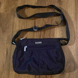 Black baggallini nylon crossbody with three outside pockets.